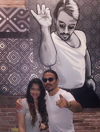 Girl standing with Nusret aka salt bae in miami
